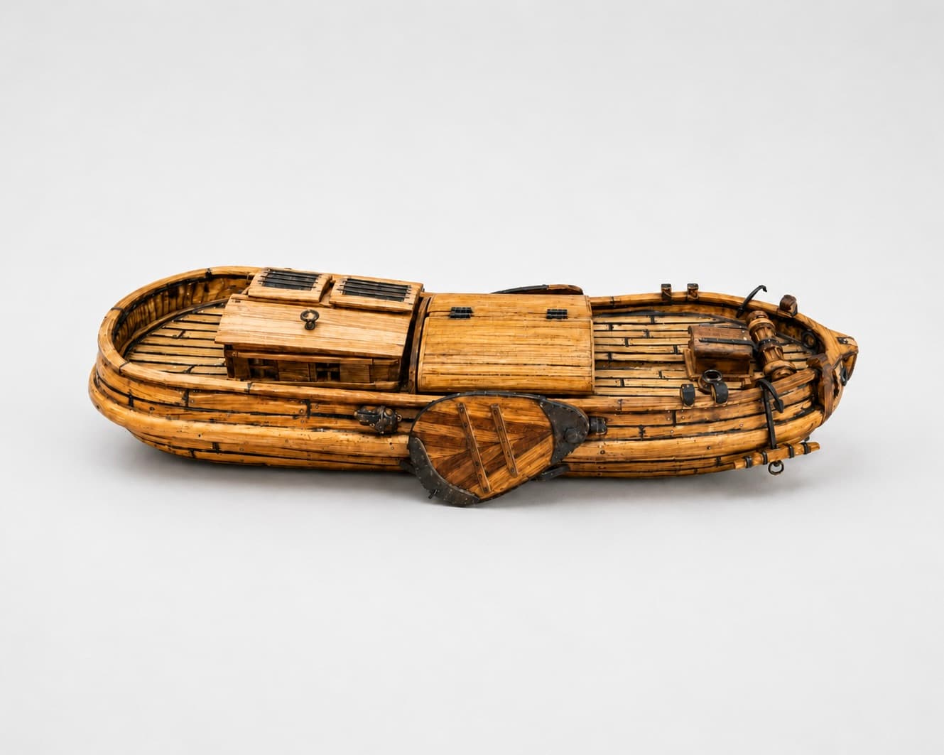 The planked hull with deck hatches, fittings and the rudder attached